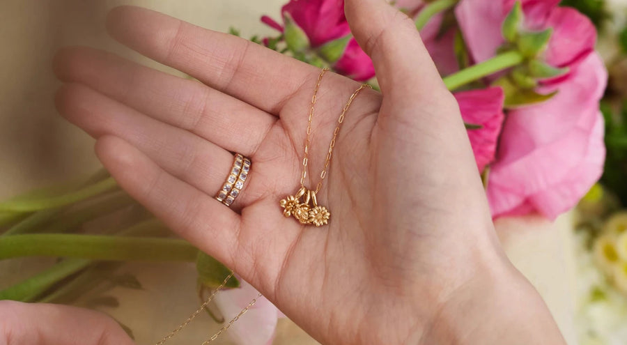 A collection of birthstone rings, birthstone hoop earnings, and birthstone stud earrings.