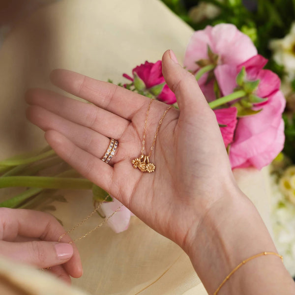 A collection of birthstone rings, birthstone hoop earnings, and birthstone stud earrings.