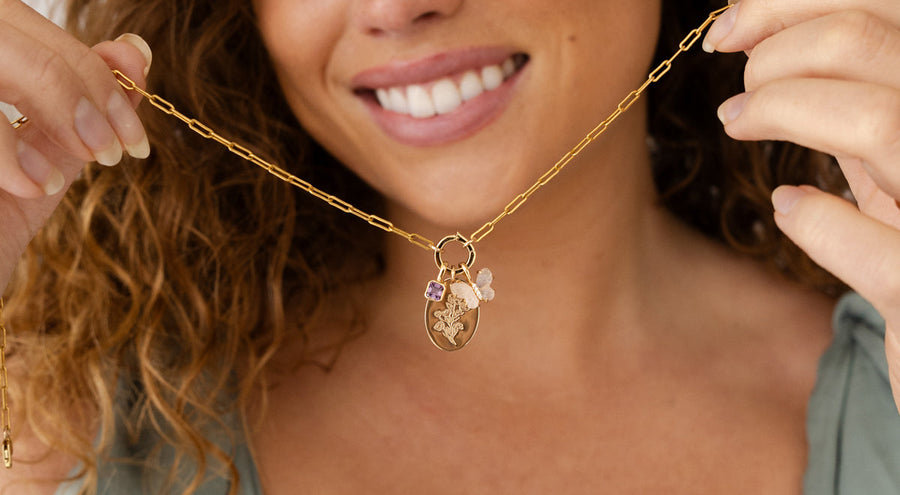 Paperclip chain and link lock clasp with a heart CZ charm and flower CZ charm