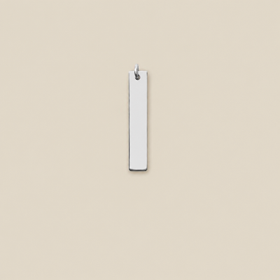 A minimalist, vertically oriented rectangular silver bar pendant with a small metal loop at the top, shown against a solid beige background.