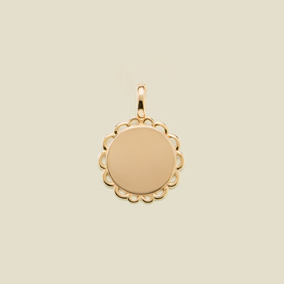 Gold round disc charm with scalloped edge detail