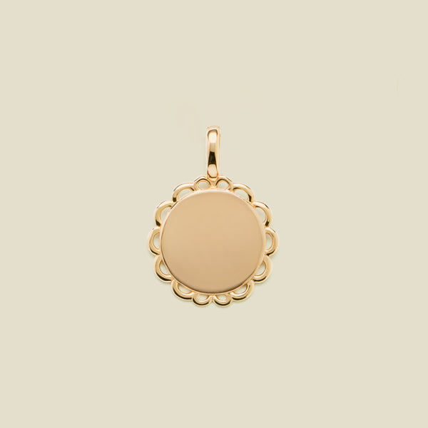 Gold round disc charm with scalloped edge detail