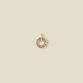 A circular pendant featuring light purple baguette-cut stones around a hollow center, displayed against a solid light beige background.