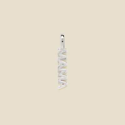 Silver 'MAMA' pendant on a beige background