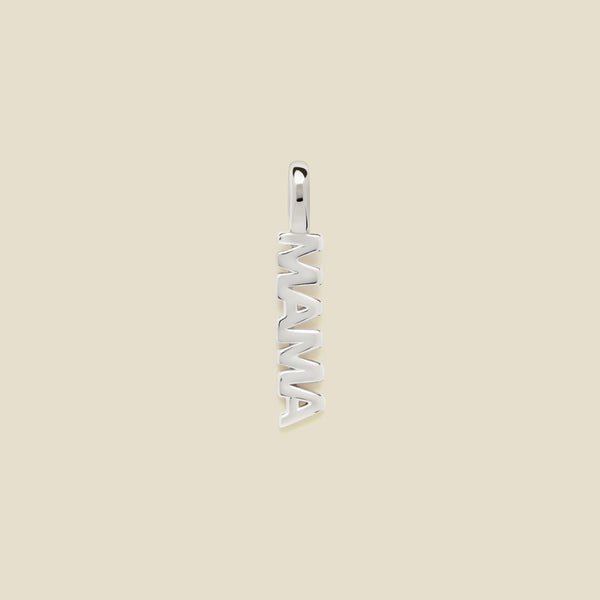 Silver 'MAMA' pendant on a beige background