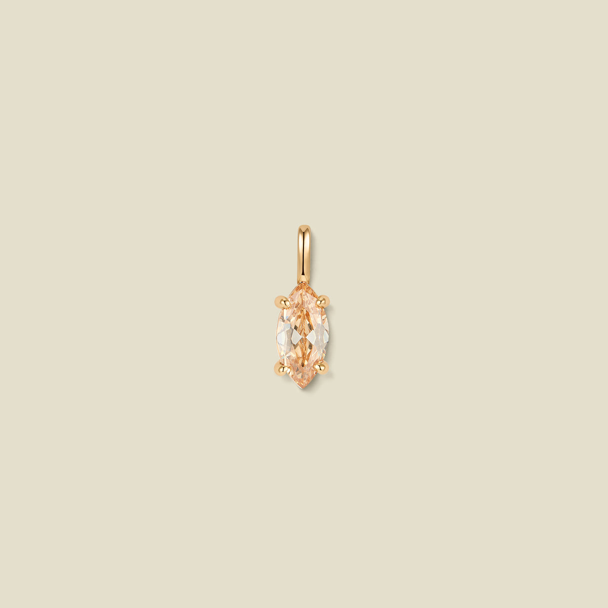 A single gold pendant featuring a marquise-cut warm golden gemstone in a prong setting, centered on a solid beige background.