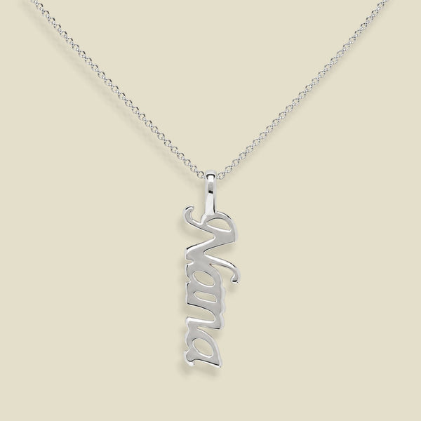 A silver nameplate necklace spelling 'Nana' in a cursive font, hanging vertically from a delicate silver chain against a solid beige background.