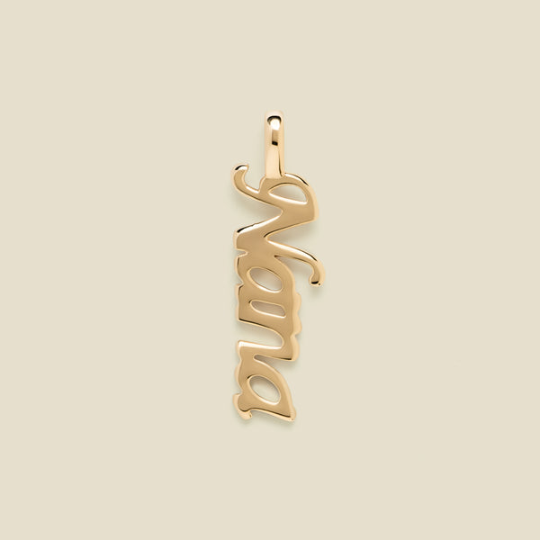 Gold "Nana" charm on a beige background