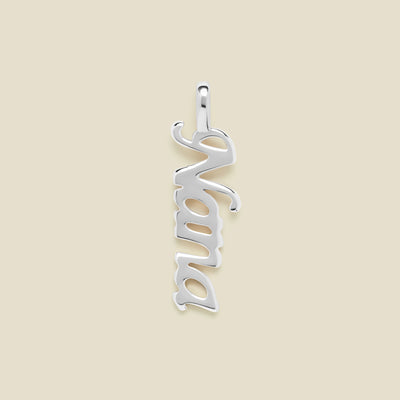 Silver "Nana" charm on a beige background