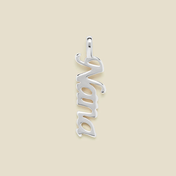 Silver "Nana" charm on a beige background