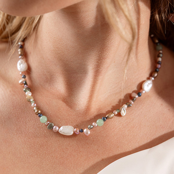 Necklace with multicolored pearls on a models neck