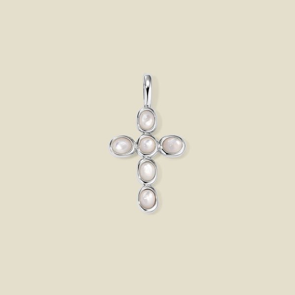 Silver cross pendant made of bezel-set pearl stones, suspended against a neutral background.