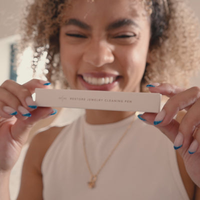 video of model walking through how to use the restore jewelry cleaning pen on gold ring
